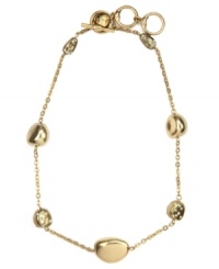 It's a gold rush! This chic necklace by Jones New York features nugget stones, some embellished with glass accents. Crafted in worn gold tone mixed metal with a toggle bar closure. Approximate length: 18 inches + 2-inch extender.