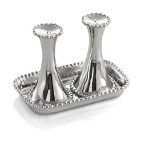 Marked by incredible handcrafting, this salt & pepper set, displayed on a perfectly sized tray, features countless molten beads carefully placed by a highly skilled artisan. The look is streamlined, timeless, organic and soulful.