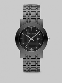 A sleek design with a black check etched dial. Quartz movement Water resistant to 5 ATM Round ion-plated stainless steel case, 34mm (1.3) Smooth bezel Black dial Bar hour markers Date display at 3 o'clock Second hand Ceramic check link bracelet, 18mm wide (0.7) Made in Switzerland 