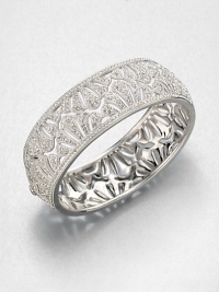 Shell Pattern Sparkle BangleThe lacy shell pattern of this shimmering pavé design is as feminine as it is fabulous.CrystalRhodium platingDiameter, about 2.25Hinged with tongue-and-groove claspImported