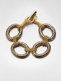 Large textured links accented with smaller wrapped link chains create an unique piece you'll wear again and again. Antique-finished goldtoneLength, about 7.75Toggle closureImported 