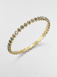 Lovely faceted glass stones in the soft hue of amethyst or a bold silver flare are dotted along a slender bangle with a golden finish.GlassGoldtoneDiameter, about 2.5Imported