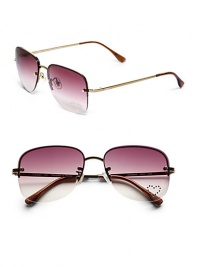 THE LOOKRectangular aviator silhouettePolycarbonate metal framesLogo at templesUV protectionSignature case includedTHE COLORLight gold frames with pink gradient lenses and rhinestone heart detailORIGINMade in France