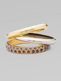 A bold set of 14k plated metal and resin covered bangles to stack along the wrist.Resin covered skin 14k plated Total width, about 2½ Made in USA Please note: Pattern may vary. 