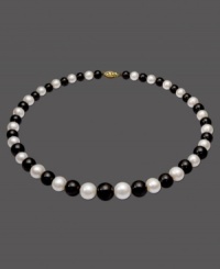 The perfect picture of contrast. This necklace features a strand of alternating cultured freshwater pearls (8-12 mm) and onyx  beads (8-12 mm). Set in 14k gold. Approximate length: 18 inches.