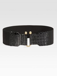 A cinching style in crocodile embossed leather and stretchy elastic with goldtone hardware. Width, about 3Imported 