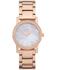 Ready to dazzle? This radiant watch by DKNY is the ticket. Rose-gold ion-plated stainless steel bracelet and round case. Bezel embellished with crystal accents. Mother-of-peal dial features rose-gold tone stick indices, crystal markers, three hands and logo. Quartz movement. Water resistant to 50 meters. Two-year limited warranty.