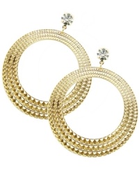 Set your inner-Gypsy free. The sweet cut-out shape and crystal design of GUESS's intricate hoops add a glam touch to any look. Set in gold tone mixed metal. Approximate drop: 3 inches.