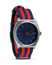 Nixon shows it's stripes with this nautical-inspired watch. A perfect fusion of performance and summer-right style, it flaunts a flexible a nylon bracelet, 100 meter water resistance, and custom colored oxide face.