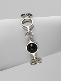 An unique and modern design featuring black agate spherical inset links and sterling silver circular links. Black agateSterling silverToggle closureLength, about 7½Imported 