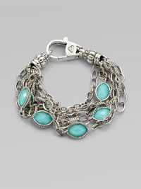 Stations of bright, faceted, crystal accented turquoise stone set in sterling silver on detailed link chains. Crystal accented turquoise doubletsSterling silverLength, about 7Lobster clasp closureImported