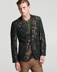 A unique camouflage sports coat gives you high visibility and exposes your taste for inventive fashion. A striking design from none other than MARC BY MARC JACOBS.