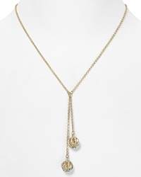 A simply styled link chain sets off a pair of crystal-bedecked tassels on this Lauren Ralph Lauren necklace, finished in plated metal.