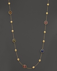 Mixed sapphires in colorful hues adorn this hand-engraved yellow gold station necklace from Marco Bicego.