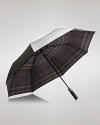 A tonal check pattern lining undergirds this protective umbrella, shading you in signature Burberry style while repelling the rain.