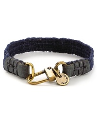 Leather and brasstone hardware bring a city edge to this canvas bracelet from Caputo.