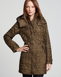 Intricate quilting lends subtle texture to an oversized Burberry Brit coat, featuring a generous hood and cinched waist for a chic yet cozy addition to your cold-weather wares.