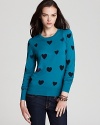 Fall in love with a heart print French Connection sweater and see ooh-la-la to this très chic style.