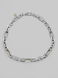 A stunning combination of cabled and smooth, oval and round links in sterling silver, with occasional links of 18k yellow gold. Sterling silver and 18k yellow gold Length, about 16 Lobster clasp Made in USA