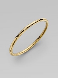 From the Martellato Collection. A luminous accent for the wrist is designed with the unique hammered look of 18k yellow gold. Chic to wear alone or doubled up with others. 18k yellow gold Diameter, about 3 Made in Italy 