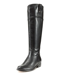 Lean leather boots with pared-down equestrian details add sleek styling--minus the stables--to fall's ladylike looks. By Corso Como.