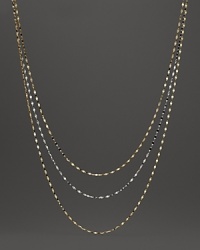 Delicate twisted chains of 14K white and yellow gold.