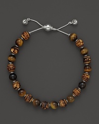 Bamboo and tigerseye beads make a natural pairing on this timeless Gucci bracelet.