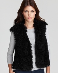 Add some edge to the everyday with a T Tahari faux-fur vest, slimly tailored and cinched with a ribbon at the waist for a refined walk on the wild side.