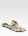 Gleaming signature hardware is at the center of this lizard-print leather sandal, with a rubber sole for added traction. Lizard-print leather upperLeather liningRubber solePadded insoleImported