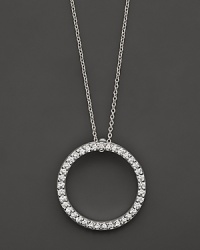 From the Tiny Treasures collection, a small diamond circle necklace; with signature ruby accent. Designed by Roberto Coin.