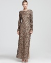 Aidan Mattox's shimmering gown dazzles in a long sleeve silhouette, modest from the front yet alluring with a deep v back.