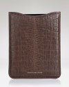 Refined leather is treated to the appearance of alligator skin for a polished and urbane home for your favorite device.