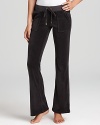 Snap-patch back pockets lend a utility-inspired feel to Juicy Couture's signature velour lounge pants.