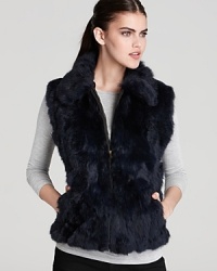 Layer on stunning style with Surell's zip-up fur vest-the perfect finishing touch over sweaters and blouses.