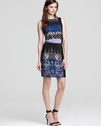 An exotic print enriches this sleeveless silk Tibi dress fusing unique colors with an ornate design for effortless day-to-night style.