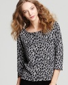 Take a walk on the wild side this fall in this lightweight wool-blend sweater featuring an authentic leopard print.