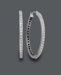 Let your style shine from the inside out! These exotic hoops feature a unique design with black diamond accents on the inside and white diamond accents on the outside. Crafted in 14k white gold. Approximate diameter: 1-1/4 inches.