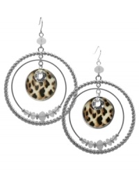 Double down on chic style. These double ring hoop earrings from GUESS go wild with a leopard print pendant at the center and white opal stones at the inner ring. Crafted in imitation rhodium-plated mixed metal. Approximate drop: 2-1/2 inches. Approximate diameter: 2 inches.