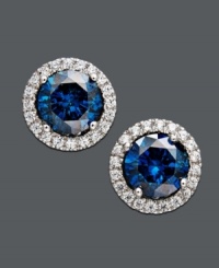 Polish your look with royalty-inspired design. Sparkling studs highlight a round-cut blue diamond (3/4 ct. t.w.) surrounded by round-cut white diamonds (1/5 ct. t.w.). Set in 14k white gold. Approximate diameter: 1/4 inch.