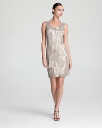 Beaded, fringed details lend a 1920's look to Aidan Mattox's glamorous tank dress.