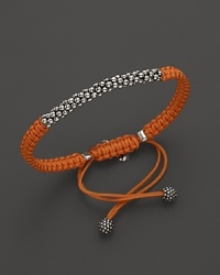 A hand braided cord bracelet in a saturated hue is adorned with Lagos' signature Caviar™ beads and finished with an adjustable closure.