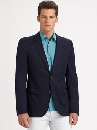 Fashionably slim, two-button sportcoat expertly tailored in superior, soft cotton.ButtonfrontWaist flap pocketsRear ventFully linedAbout 29 from shoulder to hemCottonDry cleanImported