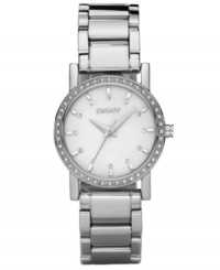 DKNY creates a dreamy watch with a mother-of-pearl dial and sparkling crystal accents at the bezel. Stainless steel bracelet and round case. Dial features stick indices and logo. Quartz movement. Water resistant to 50 meters. Two-year limited warranty.