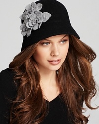 Textured gray flowers pop off the black background of this enchanting August Accessories cloche.