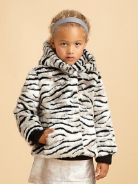 Faux is fabulous in this fluffy, exotic tiger-striped design with a cozy hood to blast away those winter chills.Attached hoodHidden snap front closeAngled front pocketsLong sleeeves with ribbed knit cuffsFully linedAcrylic/polyester/modacrylicDry cleanImported