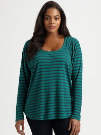 Classic stripes meet an undeniably feminine silhouette with athletic appeal. This raglan top goes perfectly with dark-denim jeans.ScoopneckRaglan sleevesCurved hemPull-on styleAbout 27 from shoulder to hemPolyester/micro modal/supima cottonMachine washMade in USA