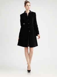 This beautifully tailored evening coat in rich velvet with satin trim has equestrian touches and a gracefully flared skirt.Satin collarNotched lapelsFitted seamed bodiceFour-button frontLong sleeves with button detail at cuffsFour front flap pocketsFlared skirtBack satin half beltBack princess seamsFully linedAbout 37 from shoulder to hemCotton/spandexDry cleanImportedSIZE & FITModel shown is 5'9 (175cm) wearing US size 4. 