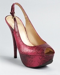 In glossy, snake embossed leather, Stuart Weitzman's Vevey platforms boast a petite peep toe and adjustable slingback.