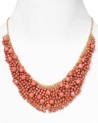 Brighten up every outfit with this layered beaded bib necklace from Cara accented by a dramatic collar of coral stones.