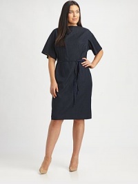 A structured silhouette, grosgrain belt and a hint of stretch give this timeless sheath the look you want: a comfortable, curve-complementing fit. BoatneckElbow-length sleevesPrincess seamsGrosgrain beltBack zipperFully linedAbout 40 from shoulder to hem75% polyester/20% viscose/5% elastane Dry cleanImported